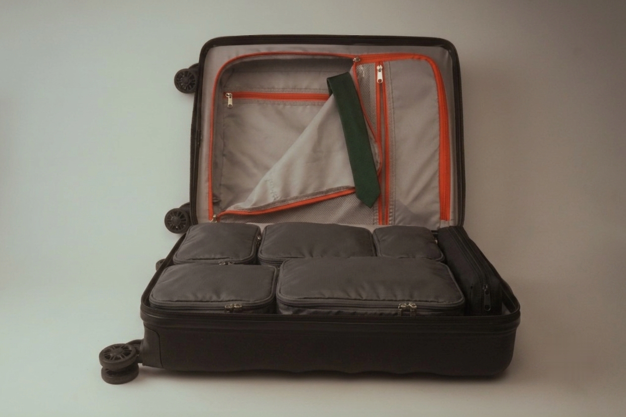 Same suitcase packed flat and organized with PackLite Air compression packing cubes
