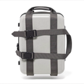 PackLite Luggage Straps in dark gray wrapped around a carry-on suitcase on white background